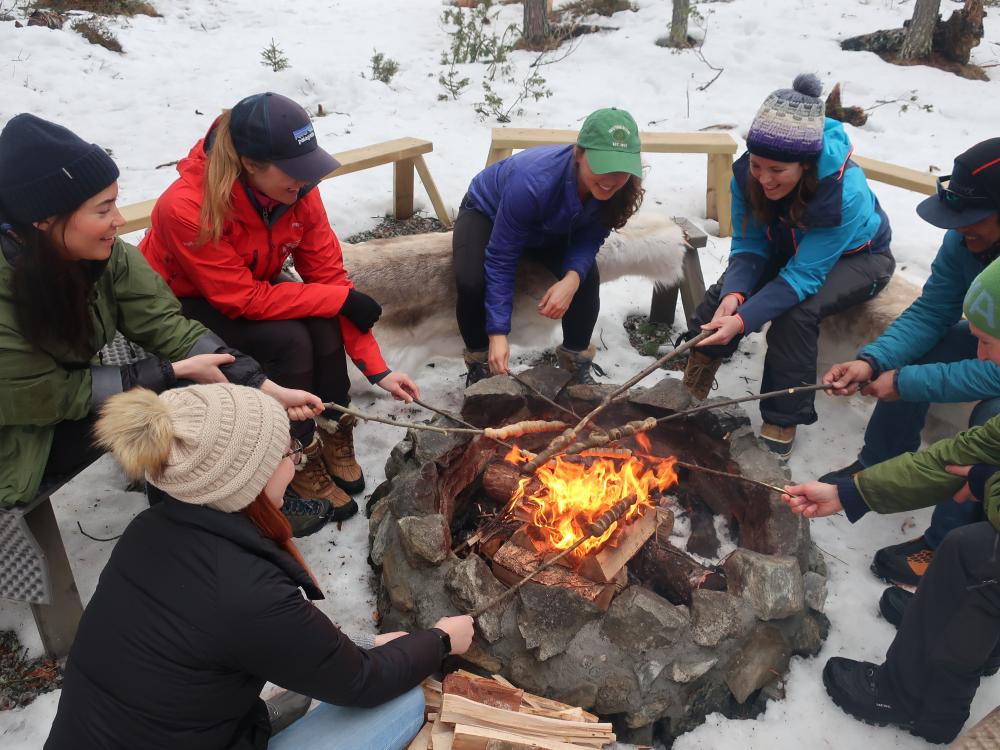 Adventure snowshoeing with campfire and dinner